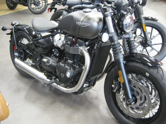 right front view of a 2022 triumph bonneville bobber in matte ironstone