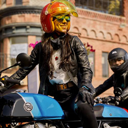 woman sitting on royal enfield meteor 350