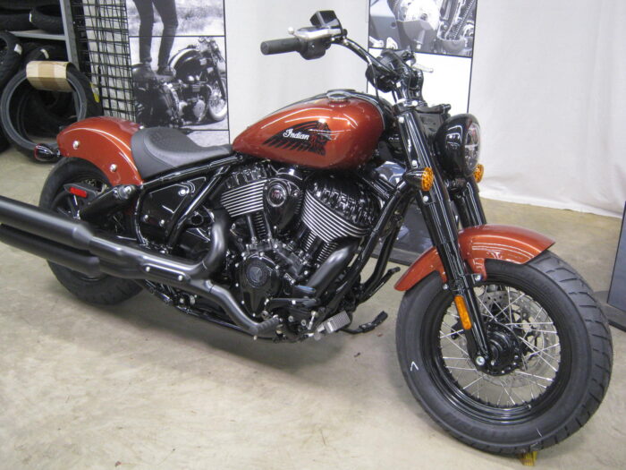 Front right of 2024 Indian Chief Bobber Dark Horse Icon in Copper Metallic Pearl